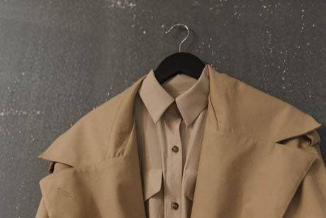A coat product photo inside the Studio app.